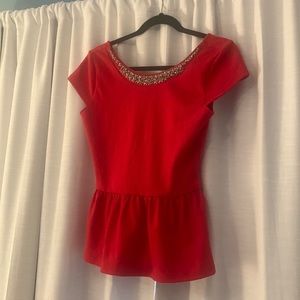 Size small. Beautiful too with gems stones on the collar.